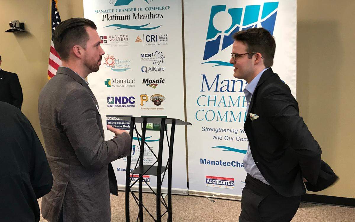 Jamie Foster, left, had several questions for The Penny Hoarder founder Kyle Taylor during the Manatee Chamber of Commerce’s Headliners Luncheon this week.