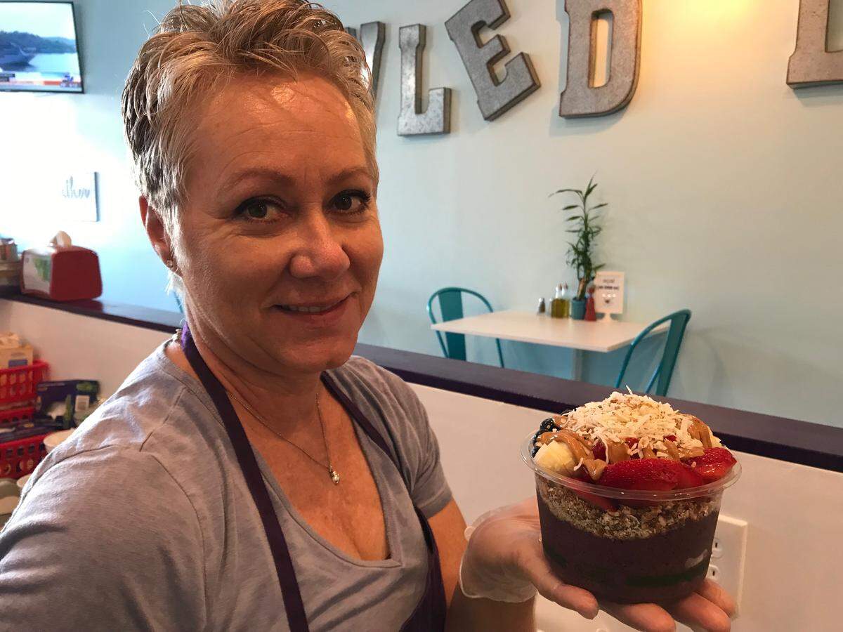 Bettina Wheeler offers a freshly made acai bowl at Bowled Life! Cafe in Palmetto. The restaurant opened in October 2018, specializing in acai bowls, smoothies, salad bowls, toast and soup.