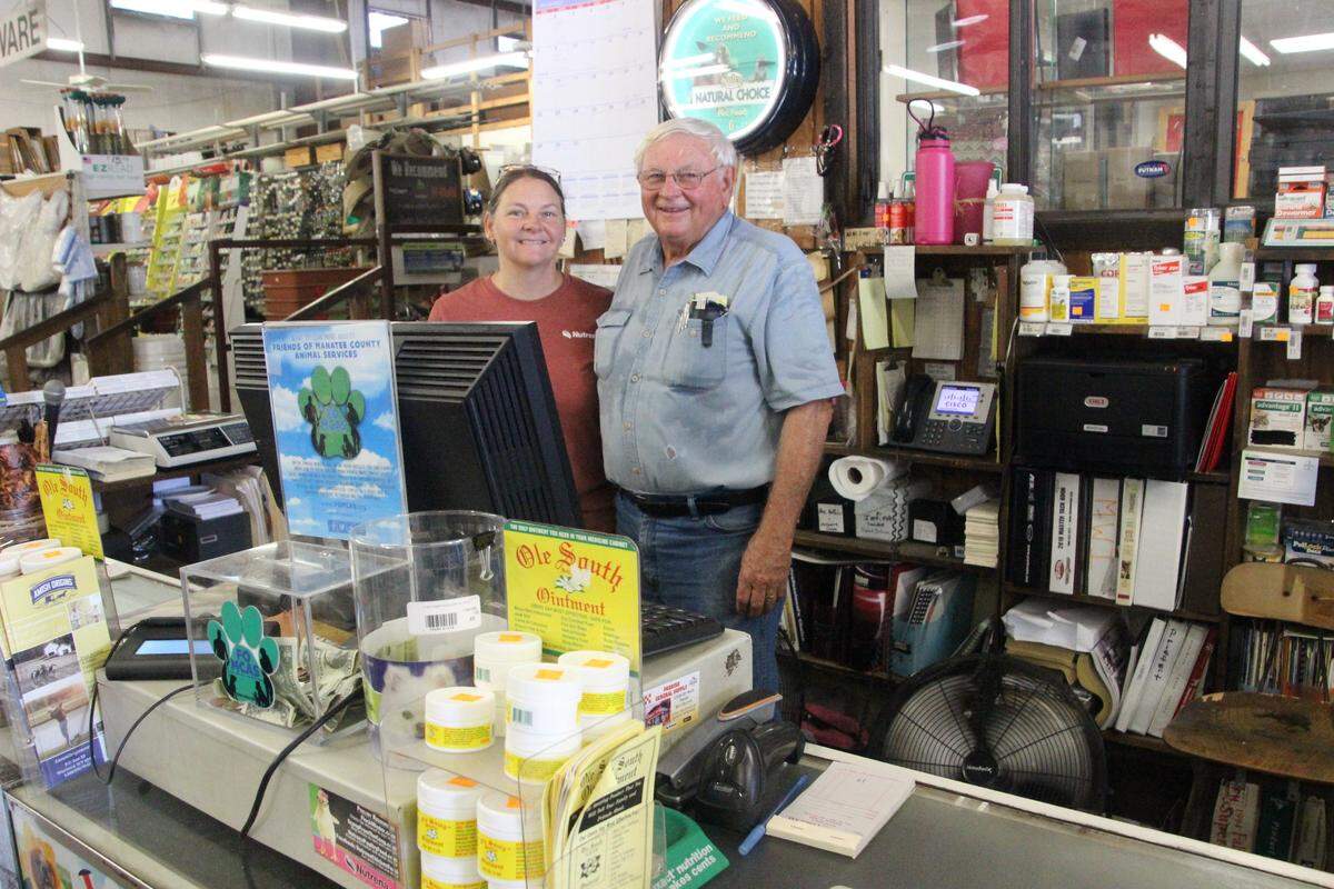 Ginger Davis staffs the counter at Come See Come Sav with her father, Jim Parks. The family has owned the business since 1974.