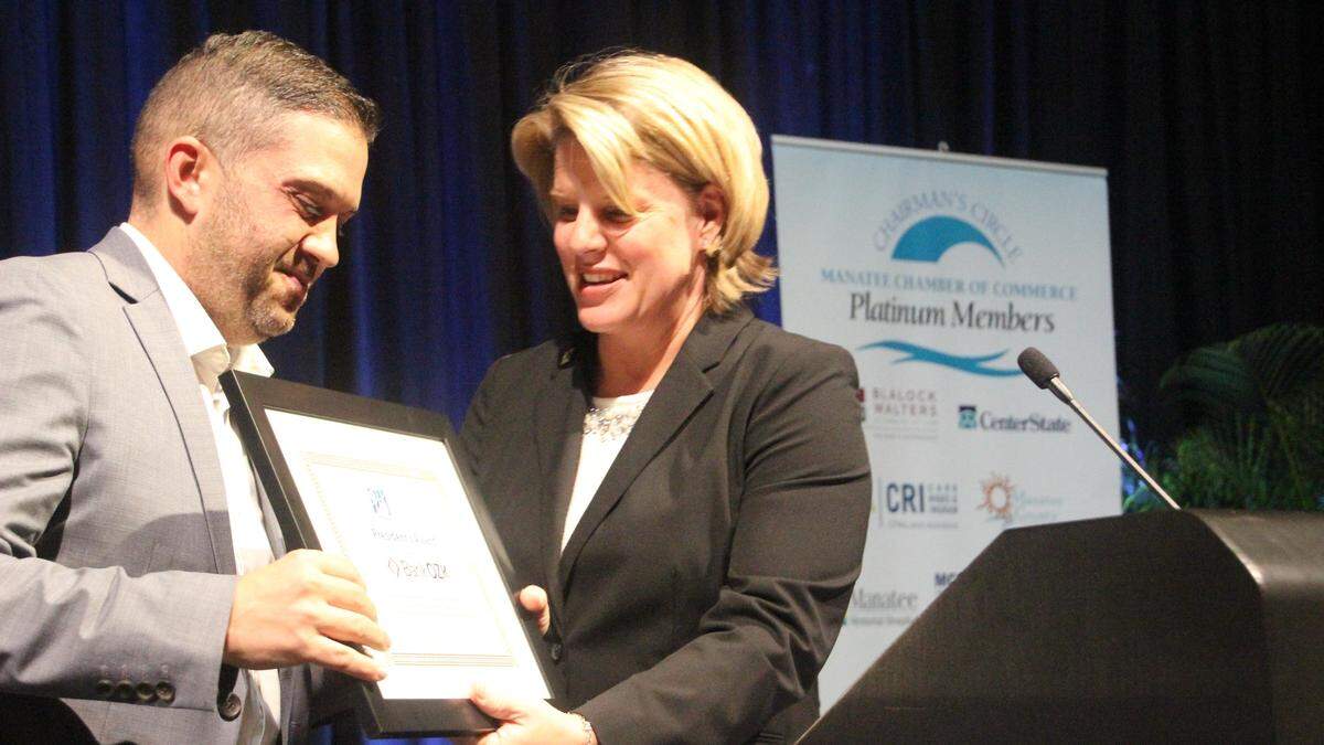 Jacki Dezelski, president and CEO of the Manatee Chamber of Commerce, presented the President’s Award to Jason Osborne of Bank OZK on Thursday night at the Bradenton Area Convention Center.