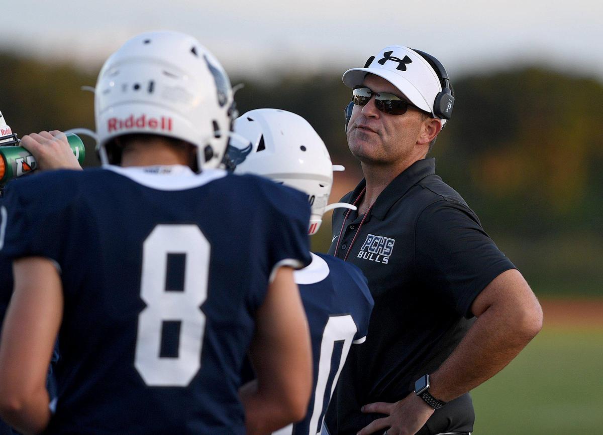 Coach Christopher Culton talks with his team during last week’s game against Sarasota Riverview at Parrish Community High.