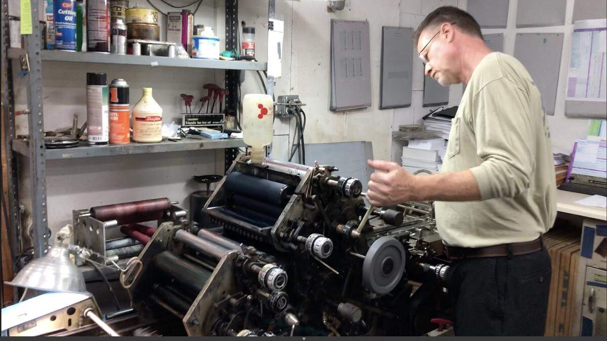 David Ardis of Alliance Print Services runs an order of envelops for a client. The company has found opportunities for business during the pandemic.