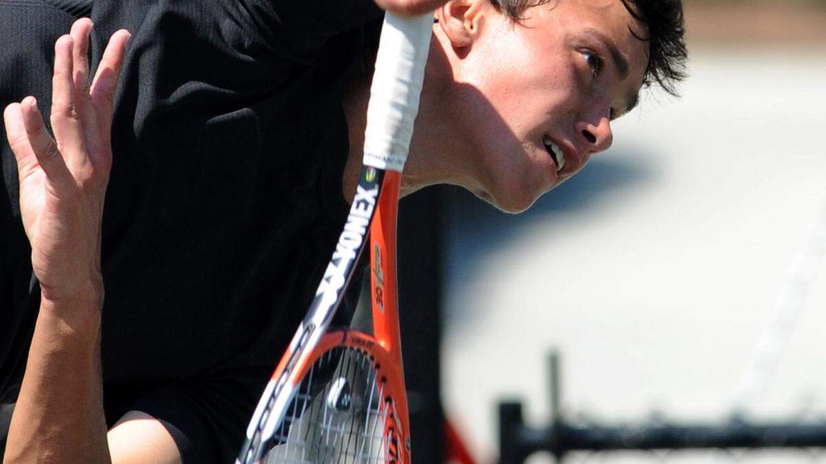 Brian Berdusco, United States, returns the ball in a doubles match with partner Russell Benkaim, United States, playing Marcelo Arevalo, of El Salvador, and Sergio Galdos, of Peru, at the 2016 Joey Gratton Sarasota Open on Wednesday at the Lakewood Ranch Athletic and Tennis Center. 
 GRANT JEFFERIES/Bradenton Herald