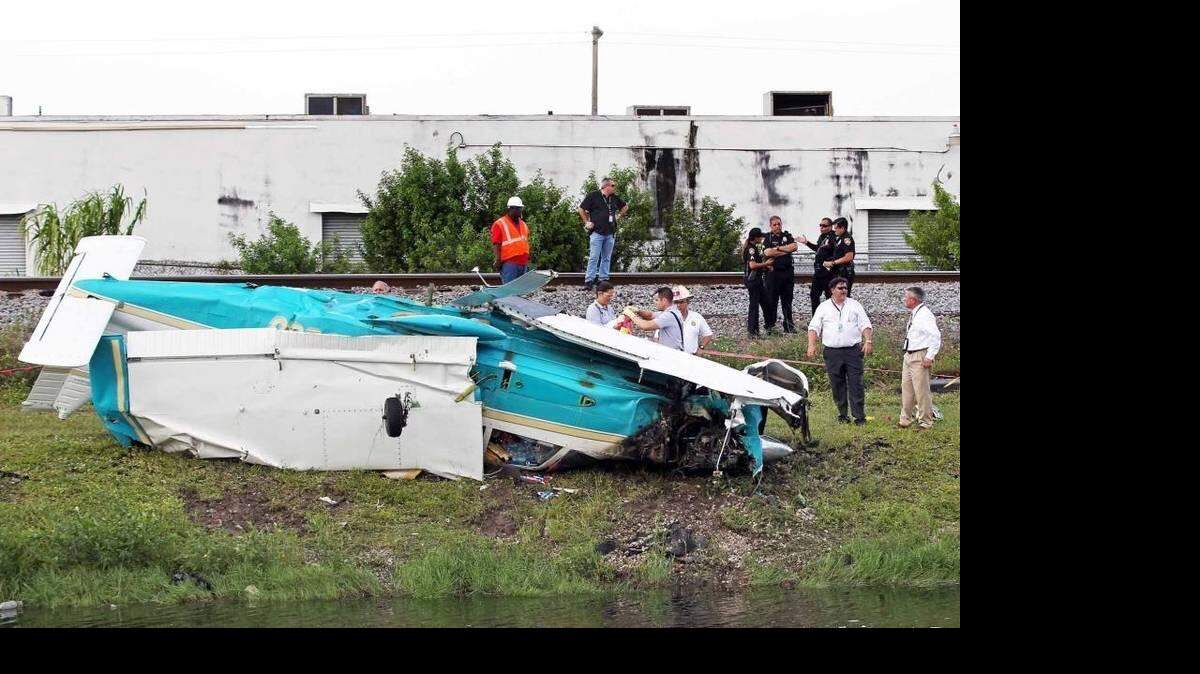 Miami-Dade County Fire Rescue and FAA investigators inspect the aircraft that crashed shortly after takeoff east of Opa-locka airport on Tuesday December 1, 2015. Three passengers survived the crash and are being treated at Ryder Trauma Center. C.M. GUERRERO CMGuerrero@elNuevoHerald.com