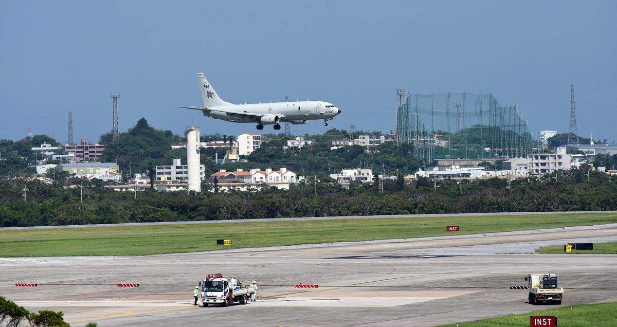 A P-8 practices touch-and-go maneuvers at Kadena Air Base in Okinawa where the plane, which specializes in submarine detection, will patrol the Pacific where China has been testing Japan’s air space and waters. TIFFANY TOMPKINS-CONDIE/Bradenton Herald