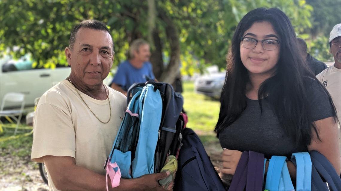 Oscar Villegas, left, and daughter Natalie, right, dropped off 18 backpacks and school supplies for the giveaway on Thursday. The Villegas donate to Freedom Gathering Church often throughout the year.