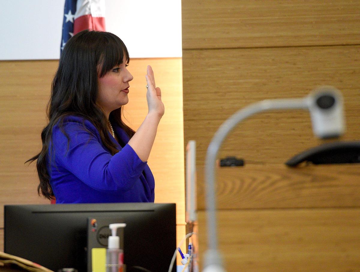 Deputy Clerk of Courts Amanda Nelson swears in the victim to testify in the trial of Dominick Hawkinsl Tuesday. Hawkins is on trial for the rape and kidnapping of a 5-year-old child.