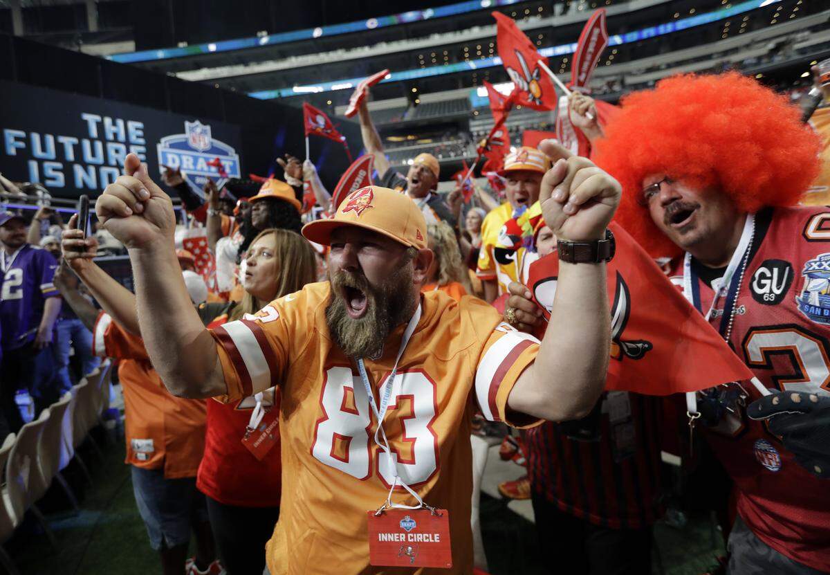 Tampa Bay Buccaneers fans cheer during the second round of the NFL draft in April in Arlington, Texas. On Friday, Bucs executives promised an exciting season for fans at the inaugural “Beyond the End Zone” luncheon, hosted by the Manatee Chamber of Commerce.