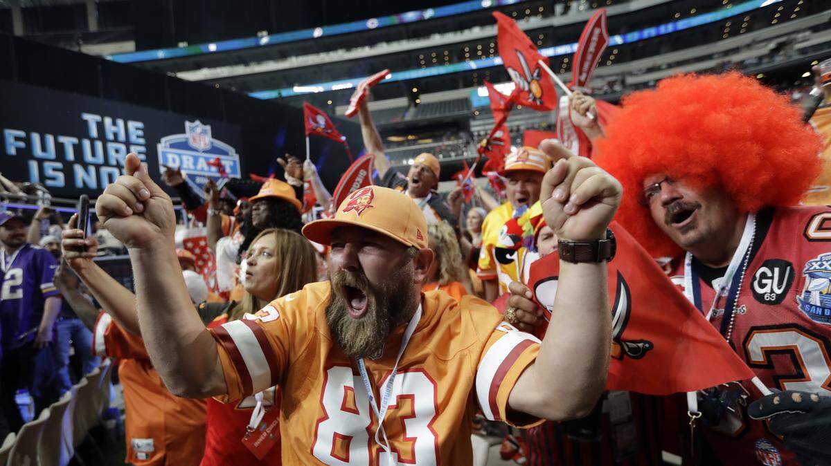 Tampa Bay Buccaneers fans cheer during the second round of the NFL draft in April in Arlington, Texas. On Friday, Bucs executives promised an exciting season for fans at the inaugural “Beyond the End Zone” luncheon, hosted by the Manatee Chamber of Commerce.