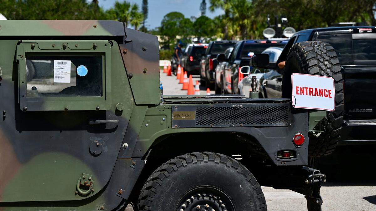 Members of the 2-108 infantry brigade combat team from New York distribute gas, ready-to-eat meals and water to those affected by Hurricane Milton at the Tom Bennett Park in Bradenton, Oct. 12, 2024.