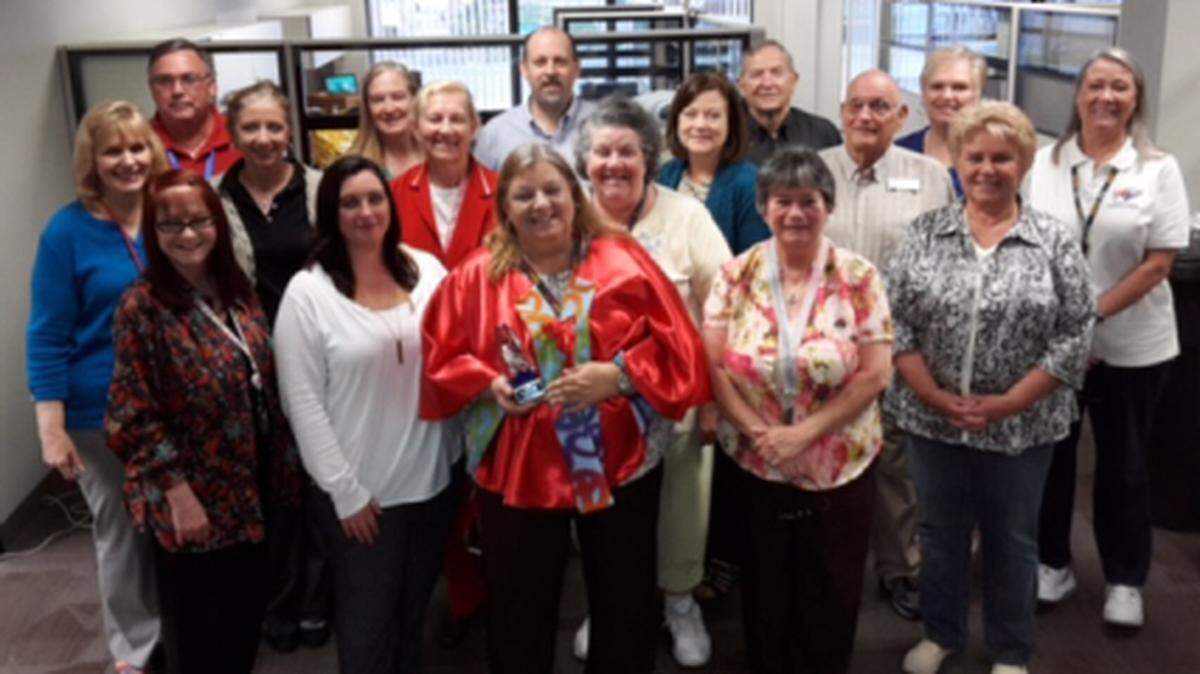 Sharon Stief, in the front row in the red cape, is celebrating her 30 years working for the Manatee County Supervisor of Elections Office. Here she is ini 2016 celebrating her 25th work anniversary with Supervisor of Elections Mike Bennett and other elections office employees. (file photo)