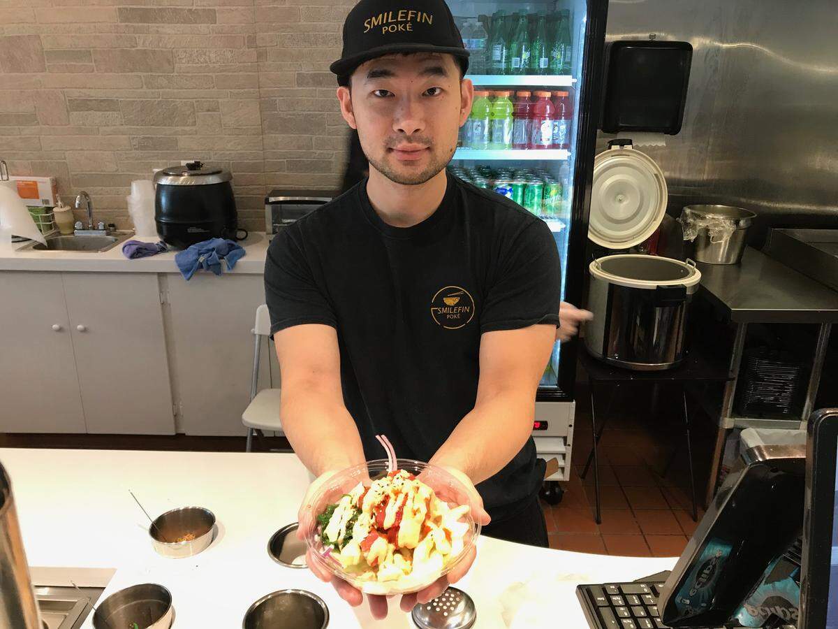 Joe Jiang offers a “Crazy Tuna” poke bowl at Smilefin Poke, a new restaurant at 8196 Tourist Center Drive. The restaurant is located in southern Manatee County near the intersection of Interstate 75 and University Parkway.