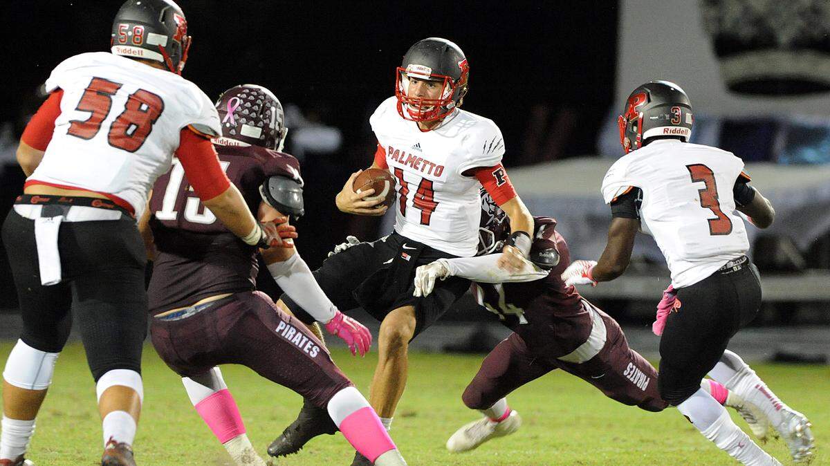 Palmetto's Jack Allison is stopped by Braden River's defense during Friday night's game at Braden River. 
 TIFFANY TOMPKINS-CONDIE/Bradenton Herald