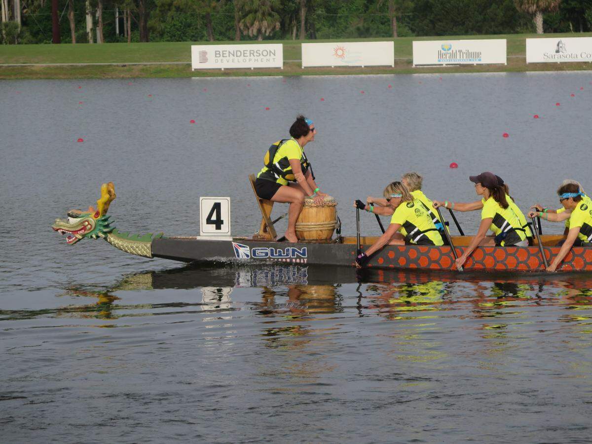 4/21/18--A dragon boat team paddles to the starting line during the 2018 Sarasota International Dragon Boat Festival.