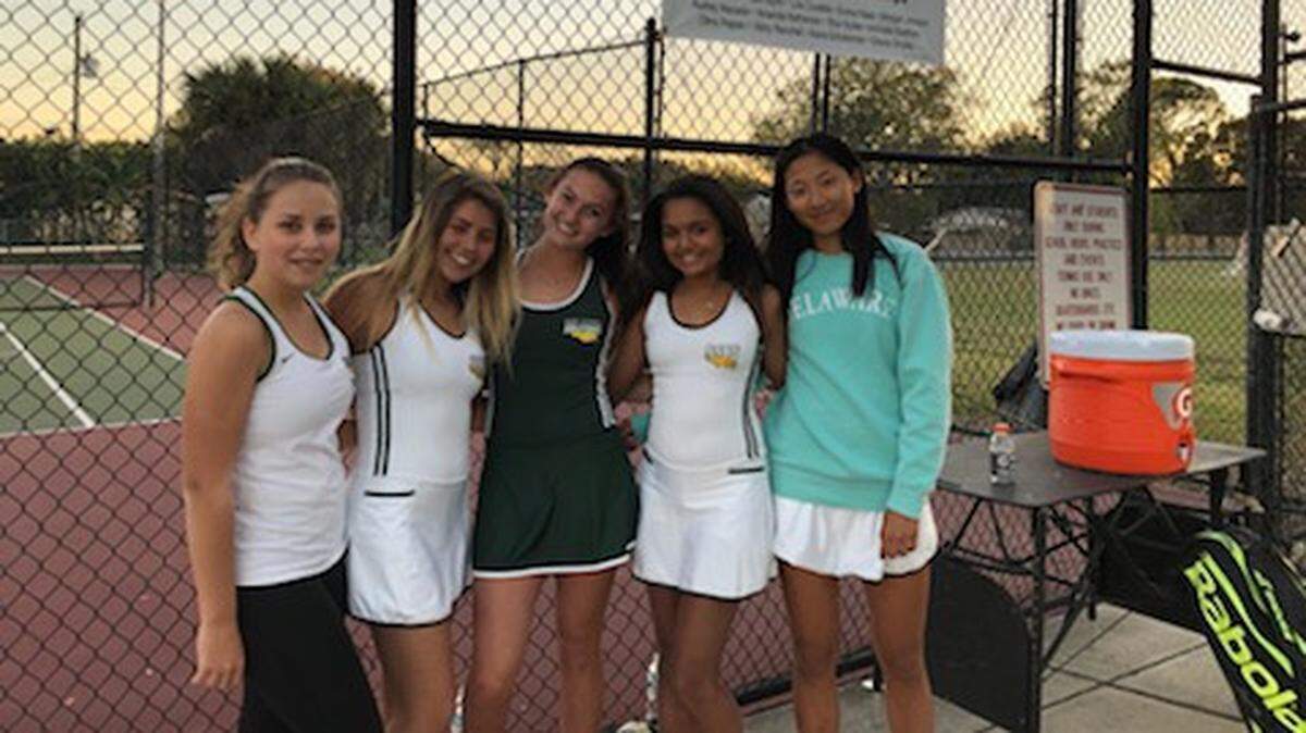 The Saint Stephen’s girls tennis team poses for a team photo after Wednesday’s 4-3 victory against Sarasota Riverview.