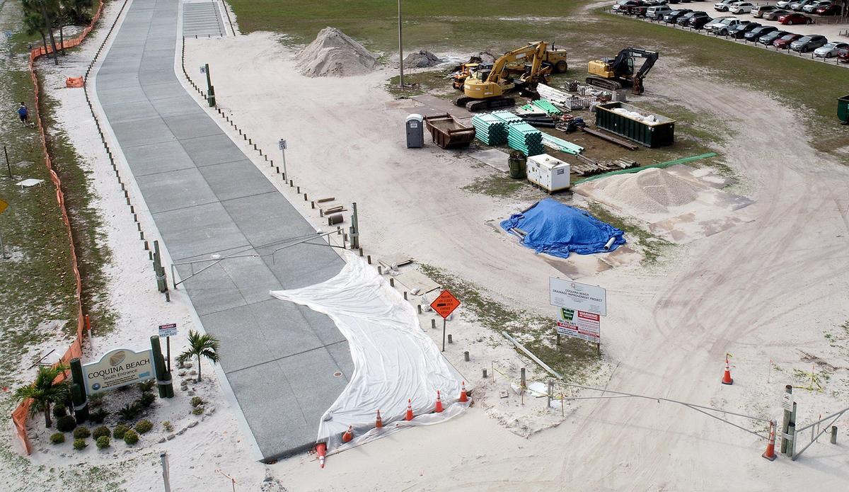 A construction project that saw the removal of several Australian Pine trees in exchange for a paved parking lot and improved drainage at Coquina Beach is nearly complete.