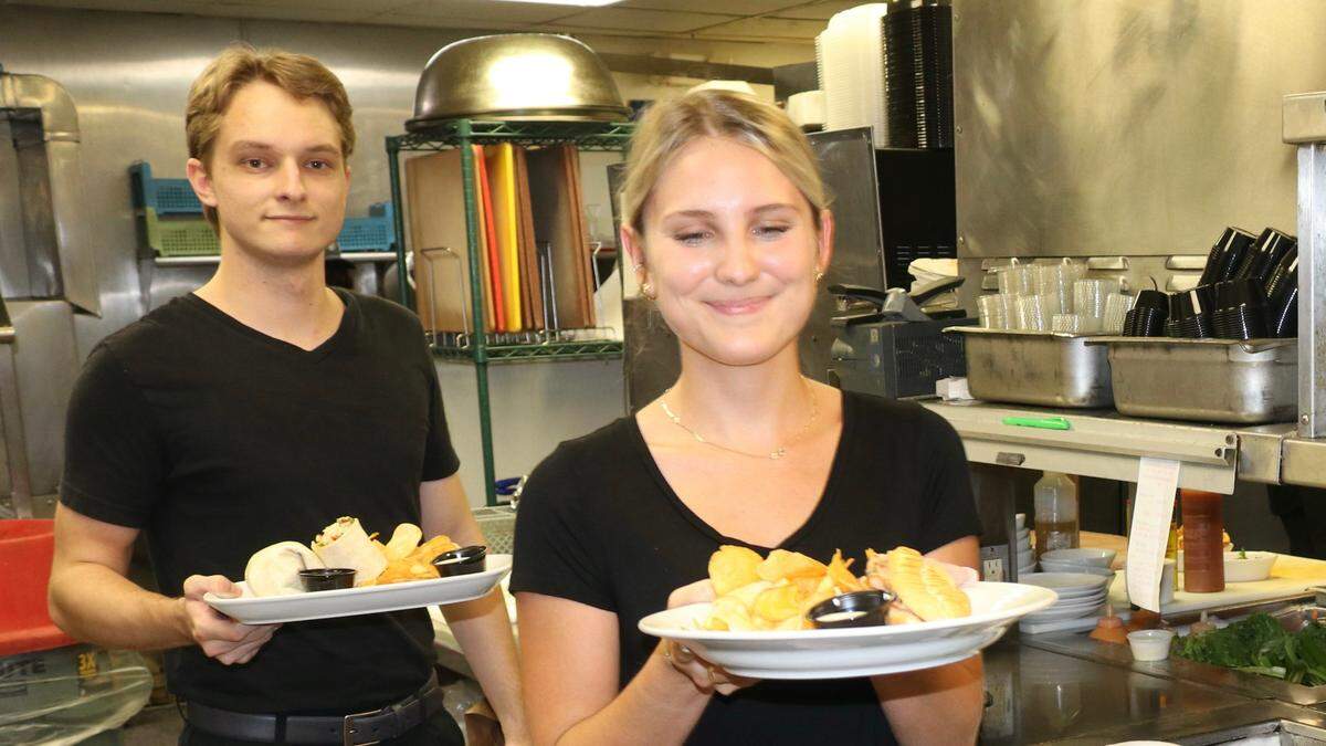 Kailey Westberry and Race Nelson bring orders from the kitchen of the Gecko’s Grill and Pub at Fruitville and Cattlemen Road.