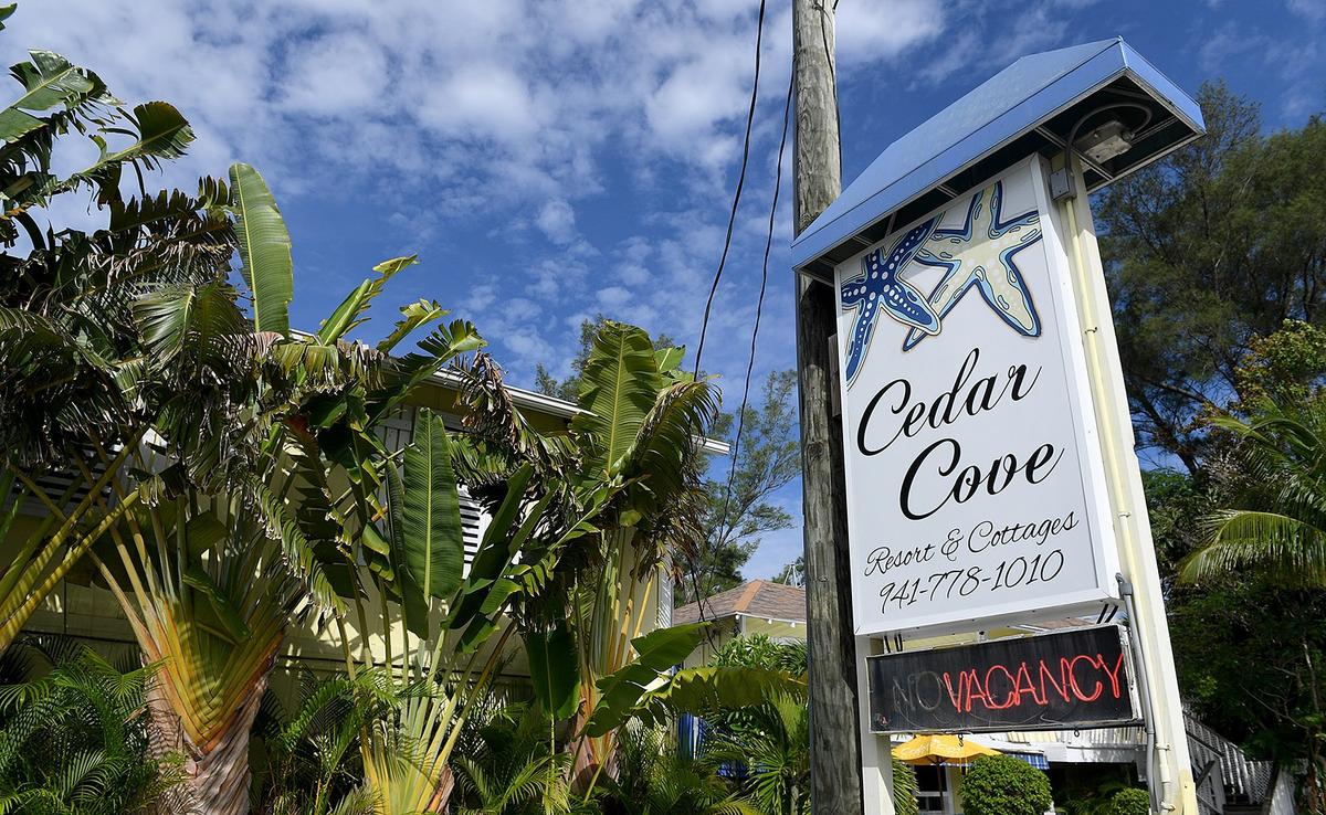 Red tide has hit area businesses hard, keeping crowds away from the island. But owners have hopes that Labor Day weekend business will be strong.