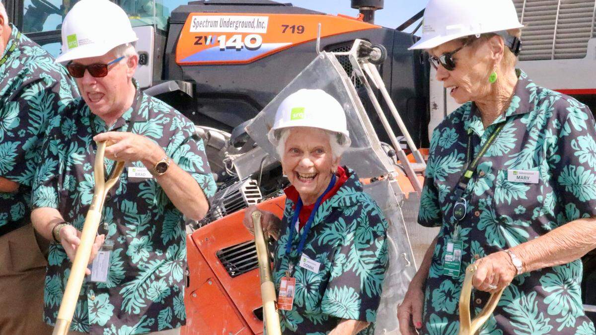 Donna Falgiani, 85, center, was among the ambassador volunteers who tossed a shovel of dirt 3/27/2023 at the groundbreaking for a new ground-level terminal at Sarasota Bradenton International Airport. Also shown are Brad Tuttle, left, and Mary Tyrrell.