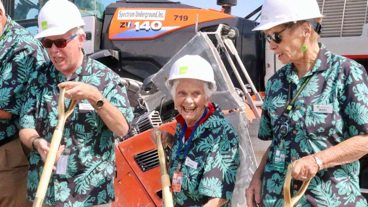 Donna Falgiani, 85, center, was among the ambassador volunteers who tossed a shovel of dirt 3/27/2023 at the groundbreaking for a new ground-level terminal at Sarasota Bradenton International Airport. Also shown are Brad Tuttle, left, and Mary Tyrrell.