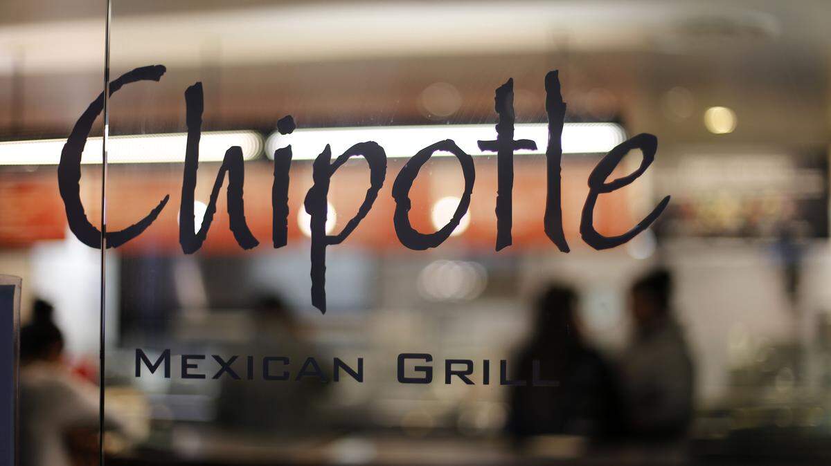 This Sunday, Dec. 27, 2015, photo, shows a Chipotle restaurant at Union Station in Washington. Chipotle said Wednesday, Jan. 6, 2016, it has been served with a federal grand jury subpoena as part of a criminal investigation tied to a norovirus outbreak this summer at one of its restaurants in California. (AP Photo/Gene J. Puskar)