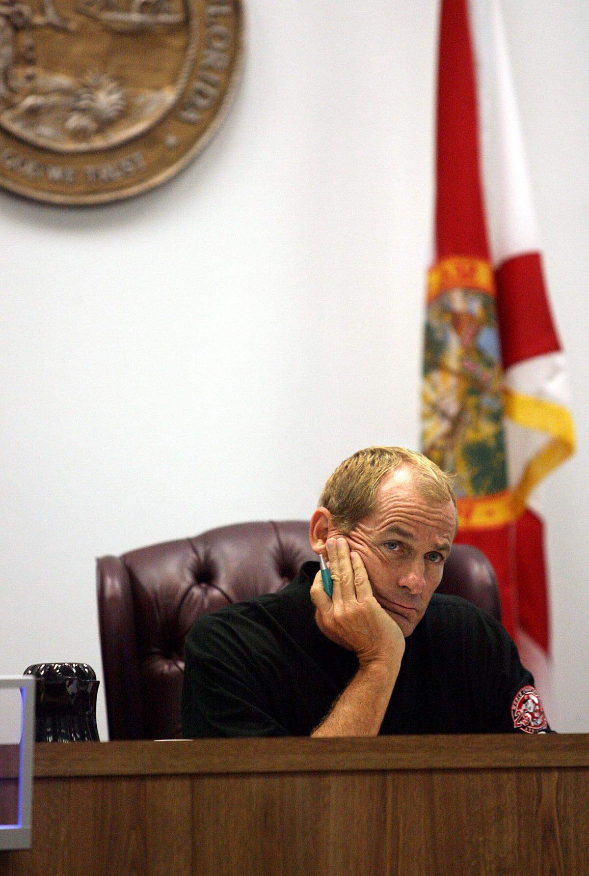 Judge Doug Henderson listens during first appearances at courtroom K in 2007 where the three charged in connection with shooting Stacy Williams III were appearing via video from the county jail.
