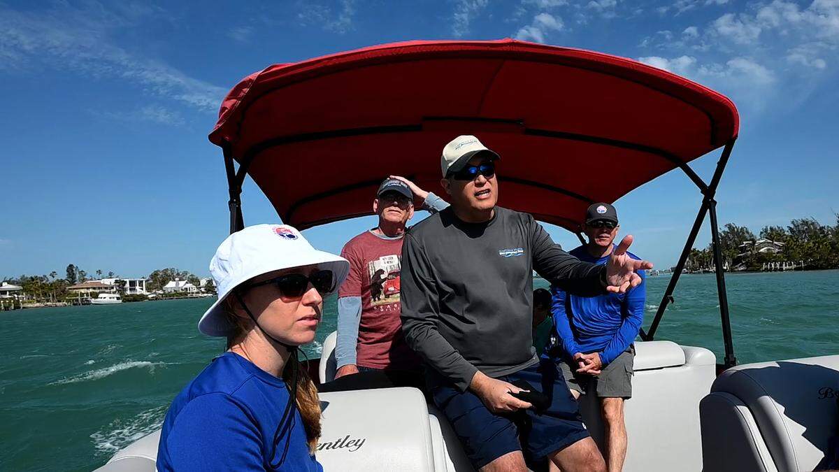 Sarasota Bay Estuary Program and Southwest Florida Water Management District scientists made a trip into upper Sarasota Bay to check on the health of seagrass in the area. From left: Megan Barry (SBEP), David Tomasko (SBEP), Chris Anastasiou (SWFWMD) and Ryan Gandy (SBEP).