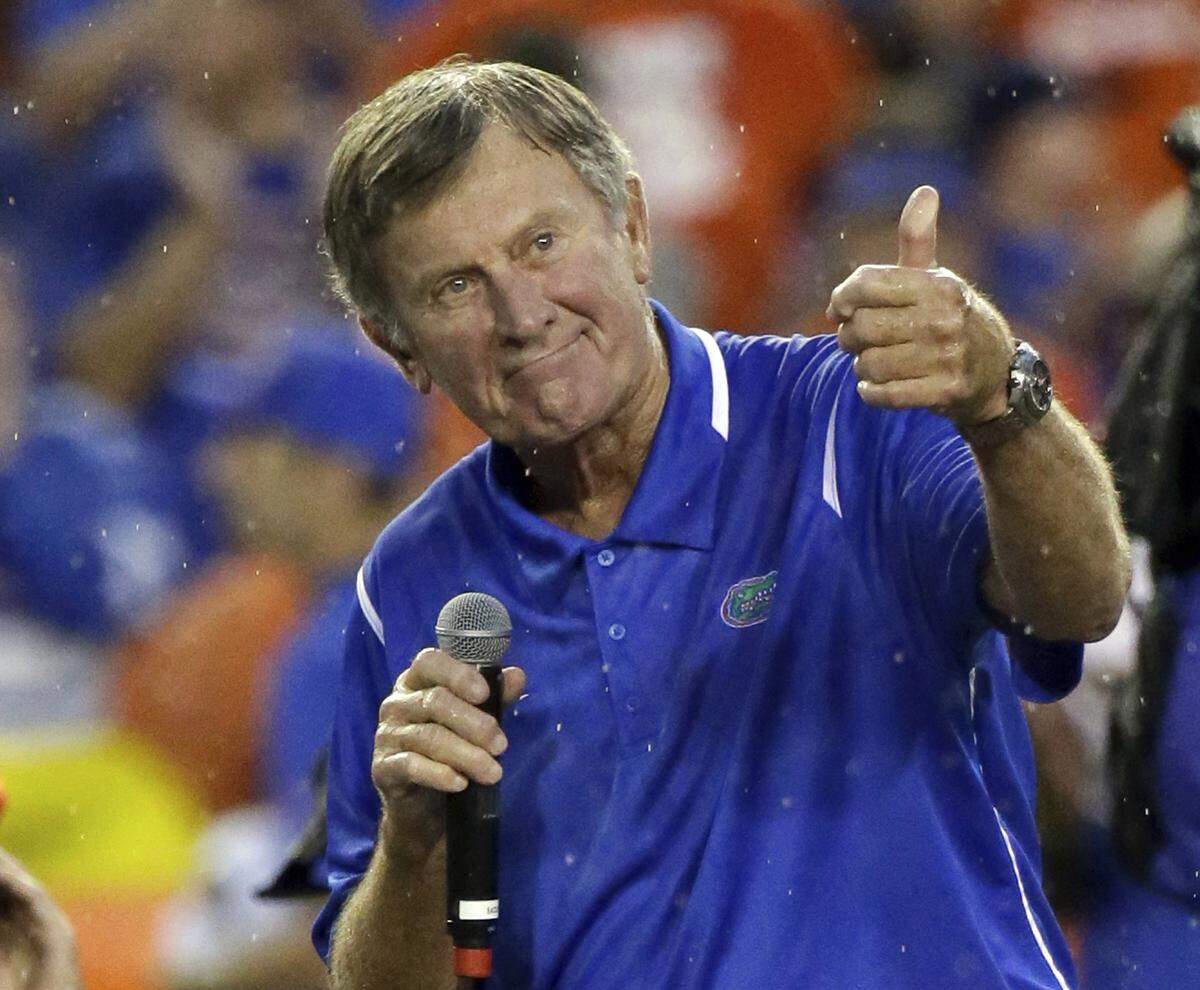 In this Saturday, Sept. 3, 2016, file photo, former Florida player and head coach Steve Spurrier makes remarks after he was honored during an NCAA college football game against Massachusetts in Gainesville.