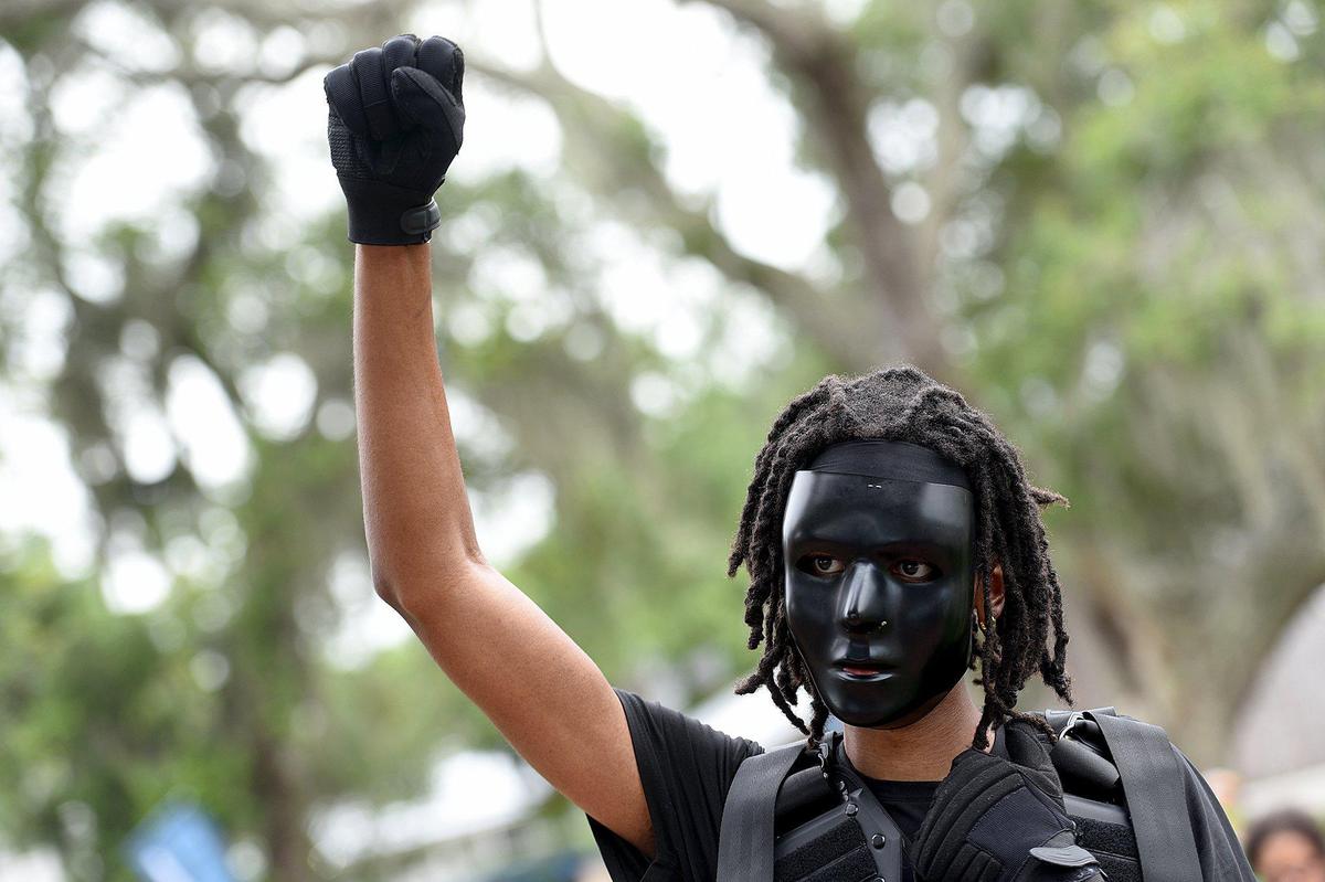 Jovian Battis raised his arm as he participated in a march with Black Lives Matter Manasota Alliance. The group marched against racism from Bradenton and joined an earlier group in Sutton Park in Palmetto.