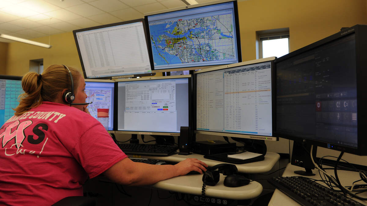 Kyra Lamb, dispatcher, keeps a watchful eye on multiple screens as she dispatches emergency responders through Manatee County's new 911 system on Monday at the Manatee County Emergency Communications Center. 
 GRANT JEFFERIES/Bradenton Herald