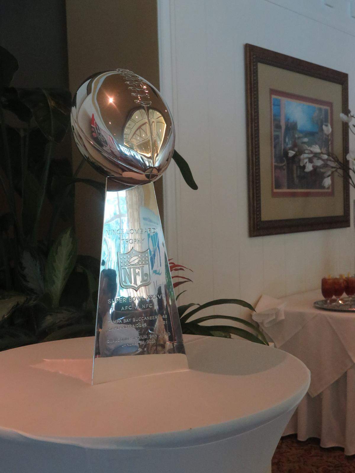 Attendees of the inaugural "Beyond the End Zone" luncheon on Friday, hosted by the Manatee Chamber of Commerce, took photos next to the Bucs' Super Bowl XXXVII trophy.
