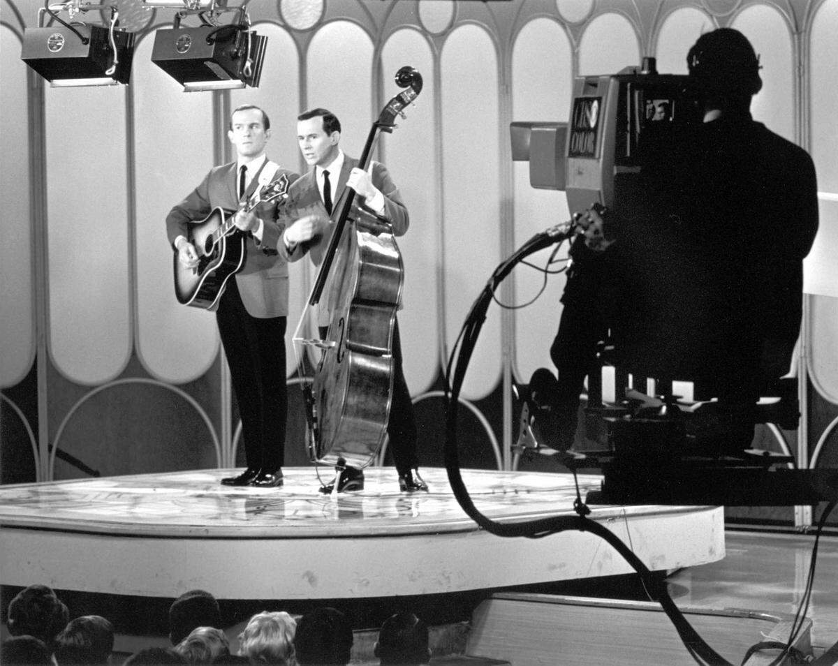 Tom and Dick perform during a taping of “The Smothers Brothers Show” in the late 1960s.