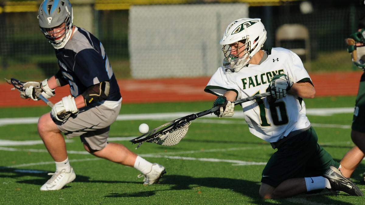 Saint Stephen's Episcopal School's Matt Goeders blocks a shot at the goal during a LaCrosse game with Out-of-Door Academy on Tuesday at Turner Athletic Field. 
 GRANT JEFFERIES/Bradenton Herald