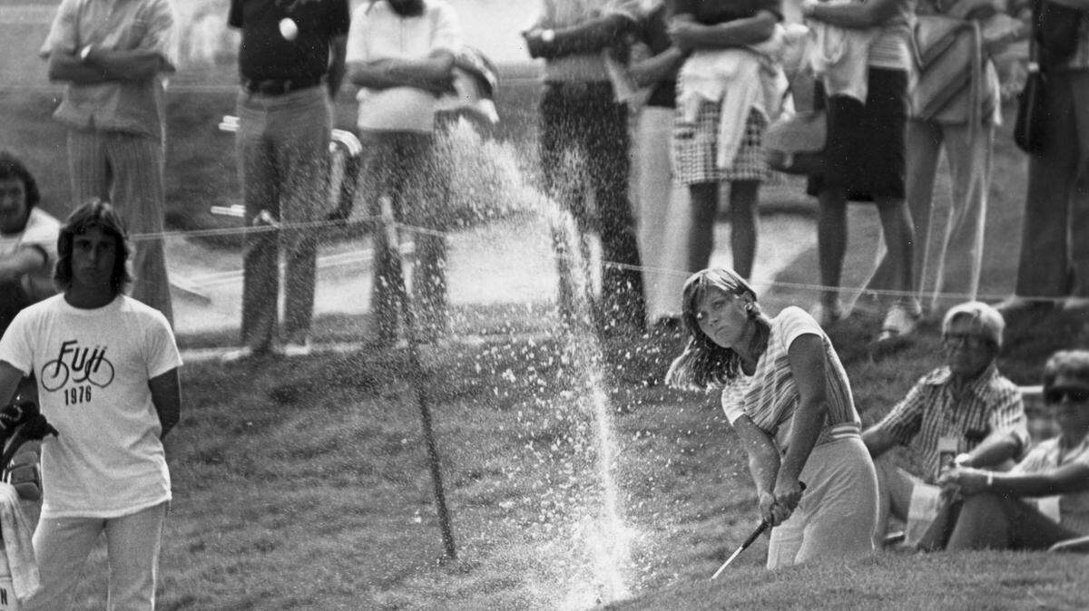 Jan Stephenson blasts out of a sand trap on the 18th hole of Calabasas Park country club during the opening round of the Carlton Golf Tournament in Calabasas, Ca., Thursday, Sept. 23, 1976. Stephenson's shot landed about 5 feet past the pin and she dropped the putt for a birdie 4. (AP Photo)