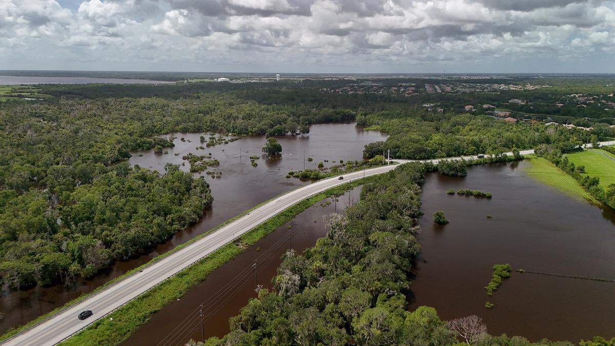 The National Weather Service says Hurricane Debby broke more than one historic record in Bradenton. A portion of Manatee River exceeded its banks below the Lake Manatee Dam and surrounded sections of Erie Road, Lake Manatee seen in upper left portion of photo.