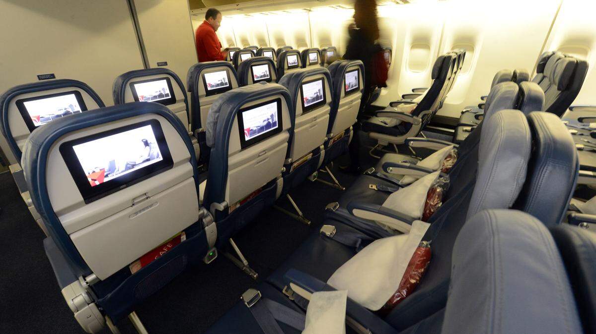 Economy seating is shown on a Delta Airlines 747 at Maynard H. Jackson International Terminal. While Delta sells just 57 percent of its first- and business-class cabins, the company said in December it will boost the figure to 70 percent by 2018.