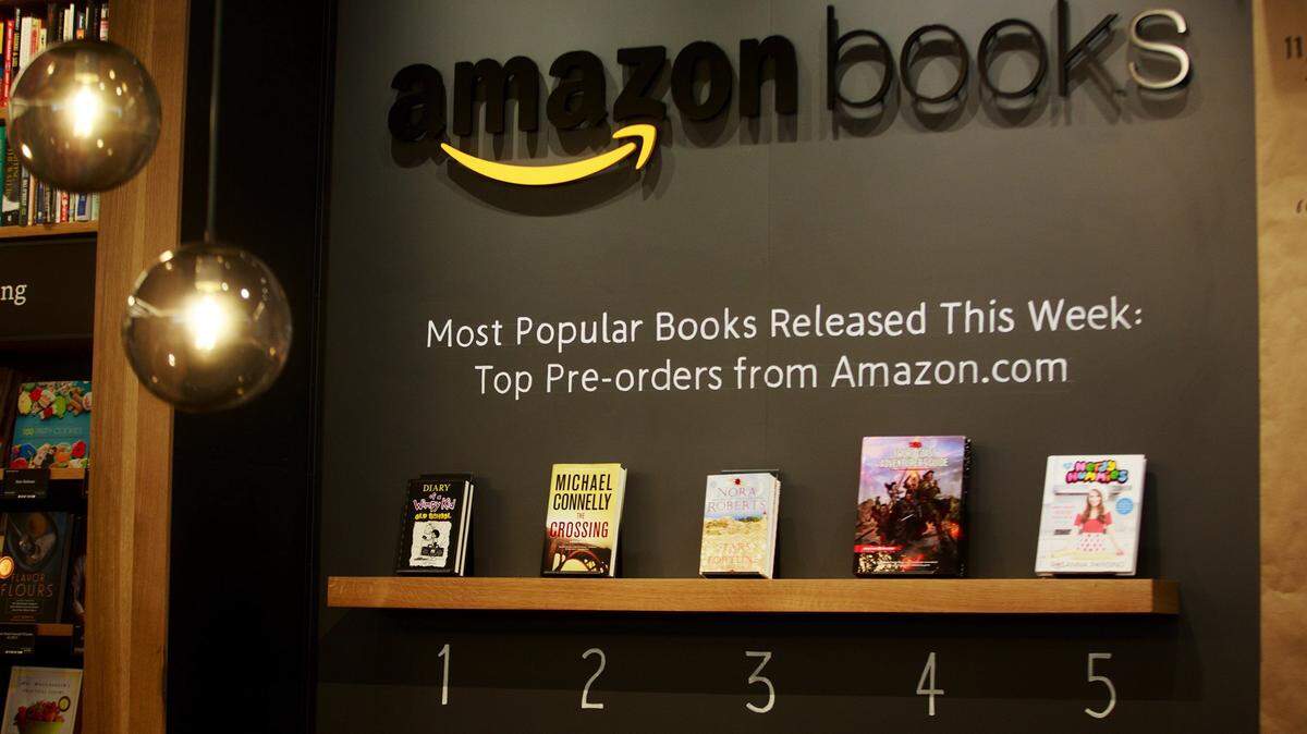In this Monday, Nov. 2, 2015 photo, top pre-order titles are on display at Amazon Books, the company's first brick-and-mortar store, in Seattle's University District. The store opens to the public on Tuesday. (Erika Schultz/The Seattle Times via AP) SEATTLE OUT; USA TODAY OUT; MAGS OUT; TELEVISION OUT; NO SALES; MANDATORY CREDIT TO BOTH THE SEATTLE TIMES AND THE PHOTOGRAPHER