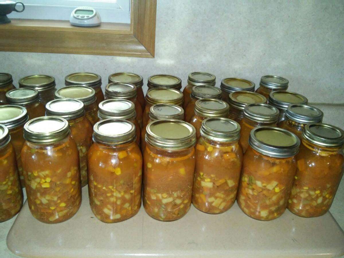 Lovina Eicher had help canning these 40 quarts of homemade veggie soup.