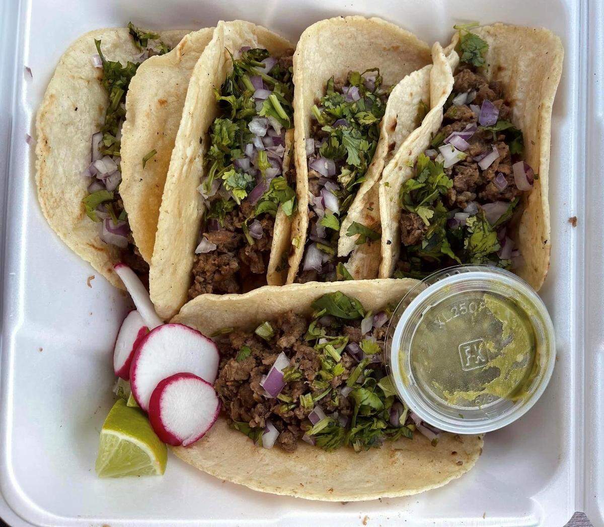Tacos at Maria’s Pupusas & Tacos are served with onion, cilantro and guacamole and are available with steak, chicken or port fillings.