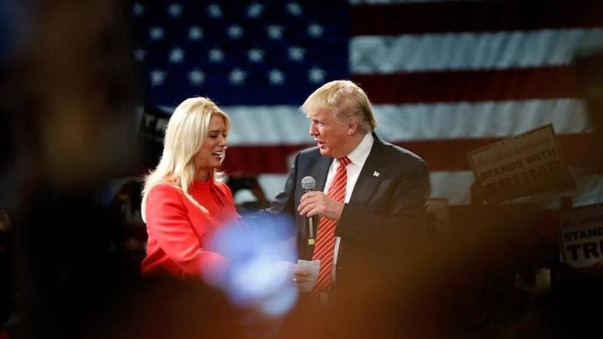 Donald Trump is greeted by Florida Attorney General Pam Bondi at a campaign event in Tampa in March.
