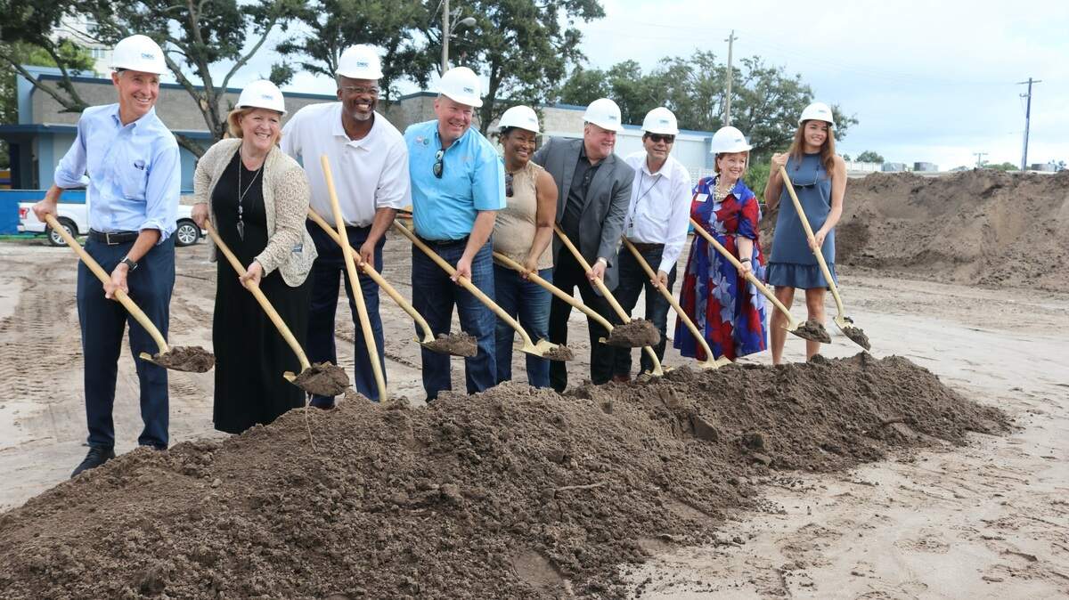 Taking part in the groundbreaking for the Nine20 Manatee apartments in Bradenton on Friday were, from  left, project principal Rick Miller, city council member Jayne Kocher, county commissioner Reggie Bellamy, mayor Gene Brown, vice mayor Pam Coachman, project principal Ron Allen, city council member Patrick Roff, city council member  Marianne Barnebey and congressional aide Susannah Morrison.