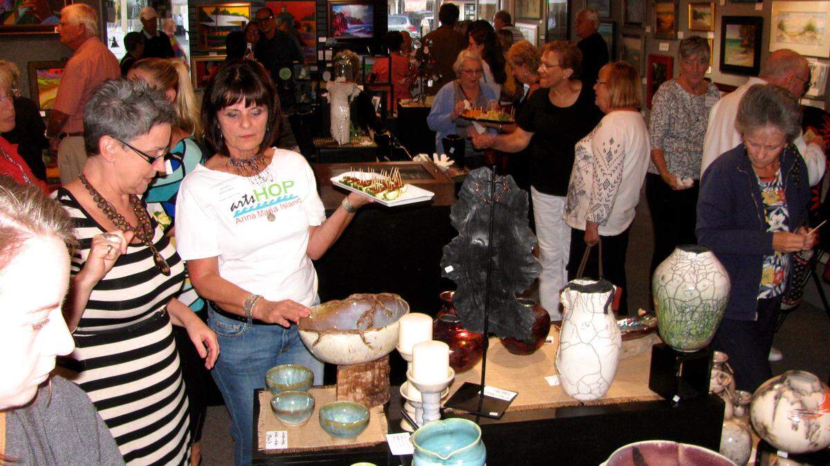 The Holmes Beach Art District will feature its annual town-wide art walks 5:30-7:30 p.m. Jan. 8 and every second Friday of the month through April 8. Participating art galleries and retail businesses will feature special exhibits, free refreshments, music and fun for all. Pictured above: A crowd of art lovers gathers at Anna Maria Island Art League. PHOTO PROVIDED