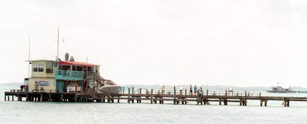 The view from Tampa Bay toward the Rod and Reel Pier, foreground, and the Anna Maria City Pier, right background, in May 2000.