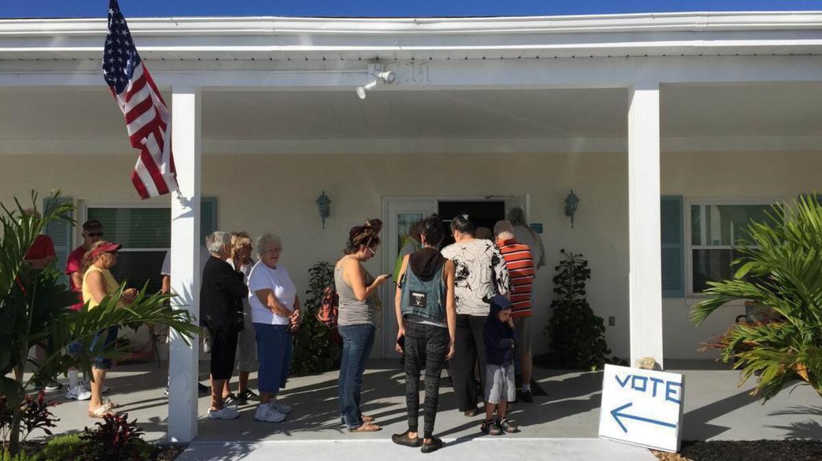 Voters line up at Plantation Village mobile home park on the morning of Election Day.