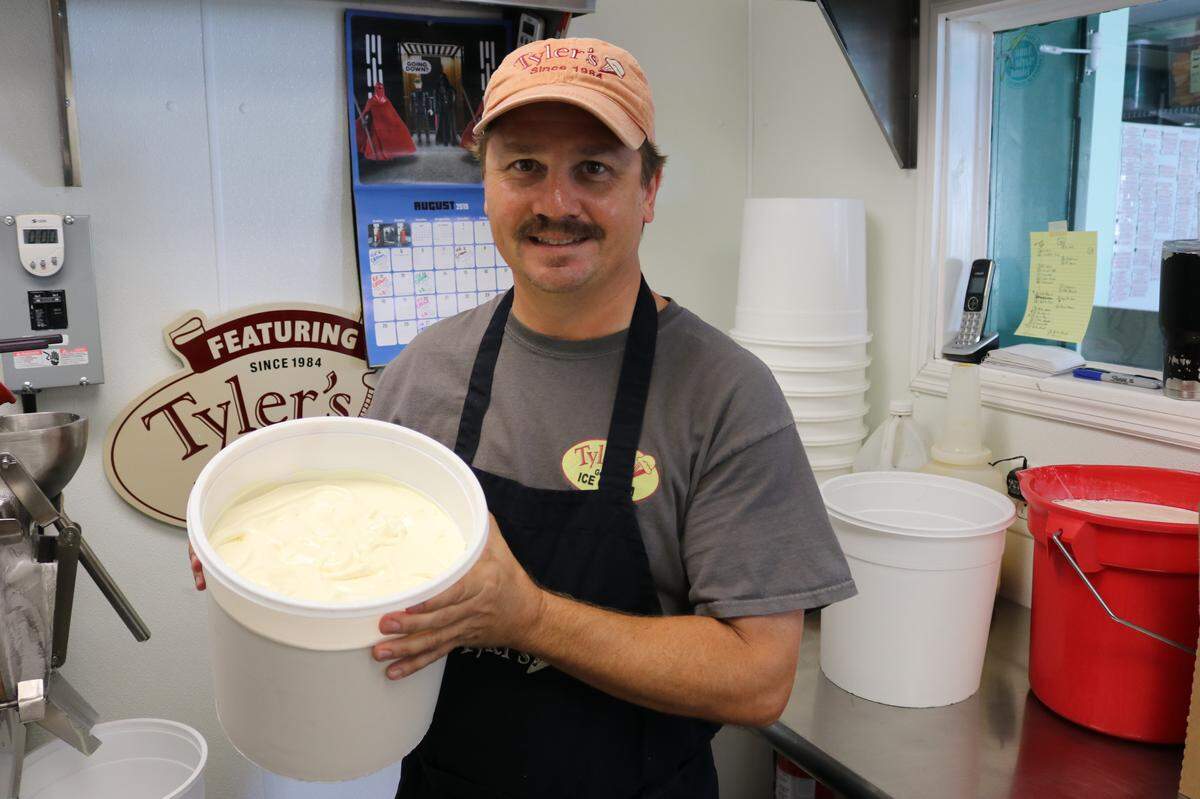 Rob Alderson displays a tub of freshly made French vanilla ice cream at Tyler’s Ice Cream, now in its 35th year at 11904 Cortez Road W.  