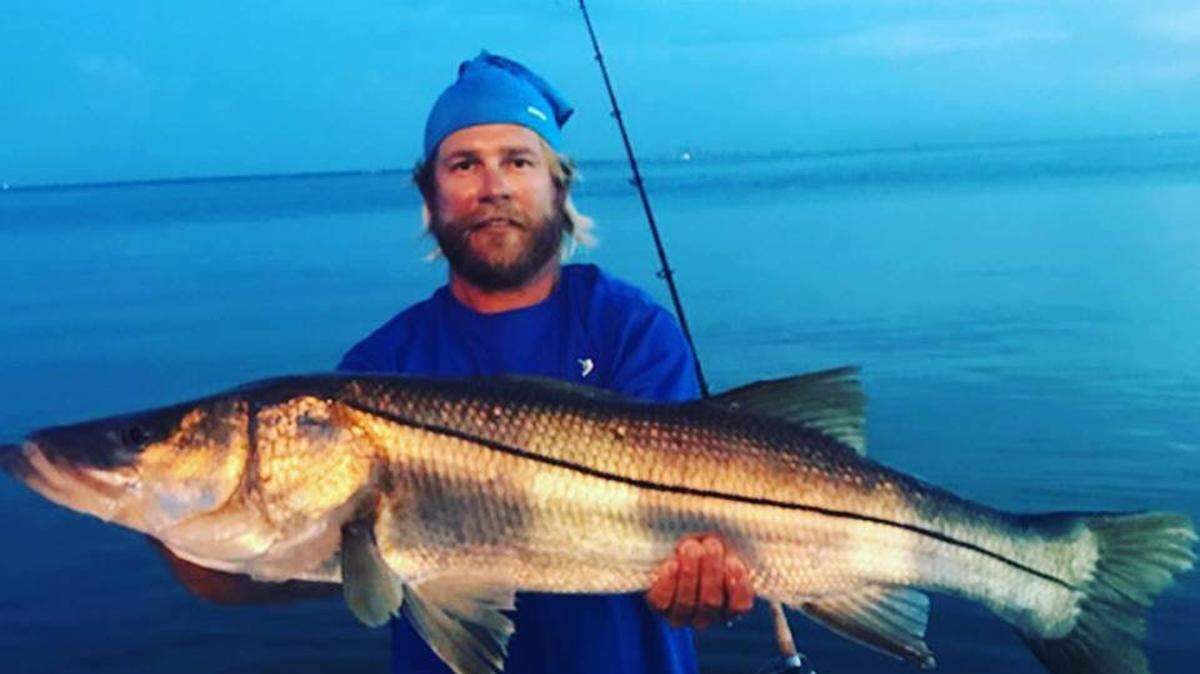 Capt. Jeremy Rzonca shows off a 43-inch snook caught in Tampa Bay during the Art Shriver Fishing Tournament in August. On Thursday, 
 Aug. 30, 2018, wildlife officials announced new regulations for snook and redfish hit by red tide to help protect the stock.