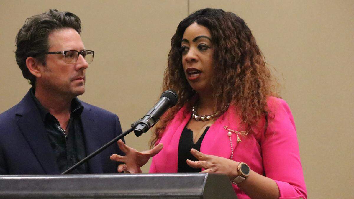 John Holz of the Lakewood Ranch Business Alliance listens as Tarnisha Cliatt, founder and president of the Manasota Black Chamber of Commerce, sums up Thursday night’s Elevating Community forum.
