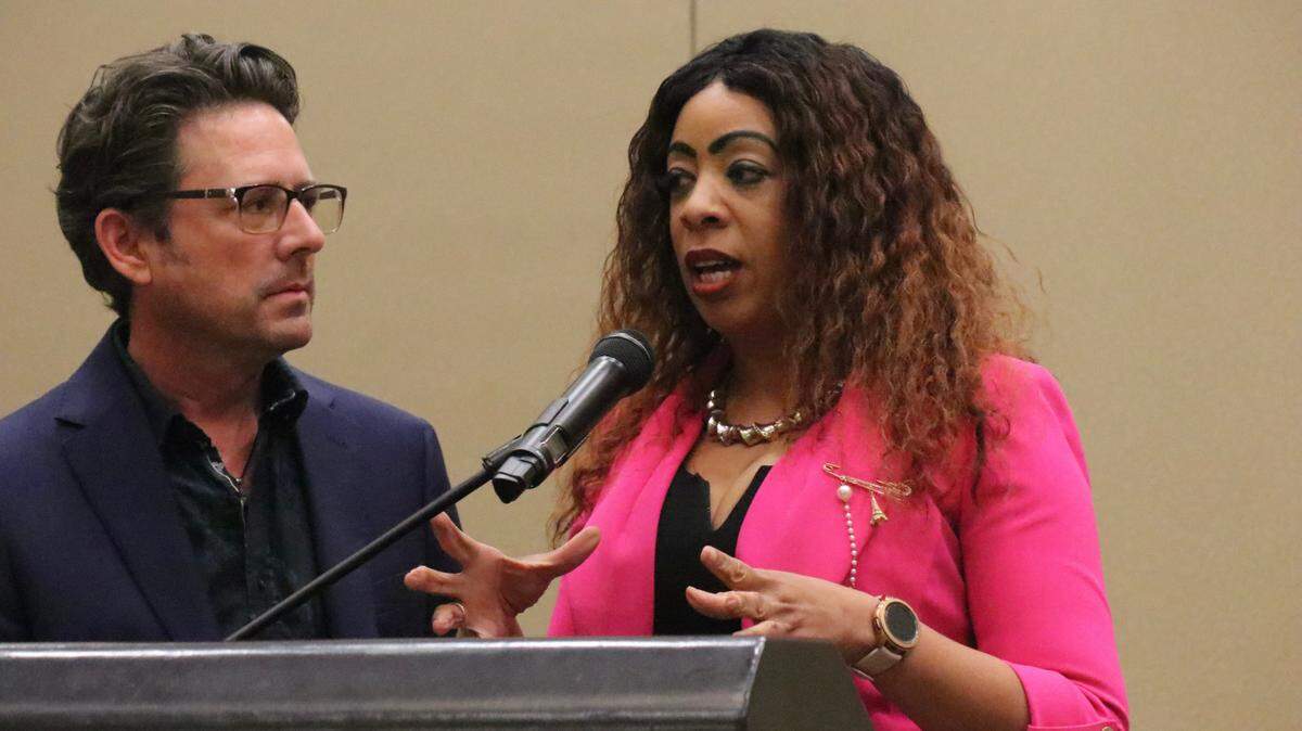 John Holz of the Lakewood Ranch Business Alliance listens as Tarnisha Cliatt, founder and president of the Manasota Black Chamber of Commerce, sums up Thursday night’s Elevating Community forum.