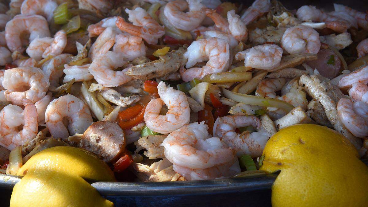 Plates were heaped full of all kinds of foods in Cortez Village during the 34th Annual Cortez Commercial Fishing Festival Saturday. 
 TIFFANY TOMPKINS/Bradenton Herald