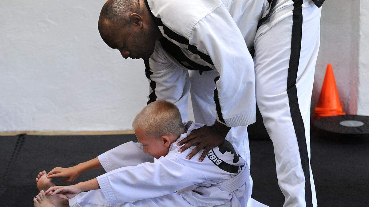 Terry Bibbins works with student Hunter Johnson, 8, at his studio, Bibbins Tae Kwon Do Martial Arts School in Palmetto. Bibbins works with children and adults with disabilities in his classes.